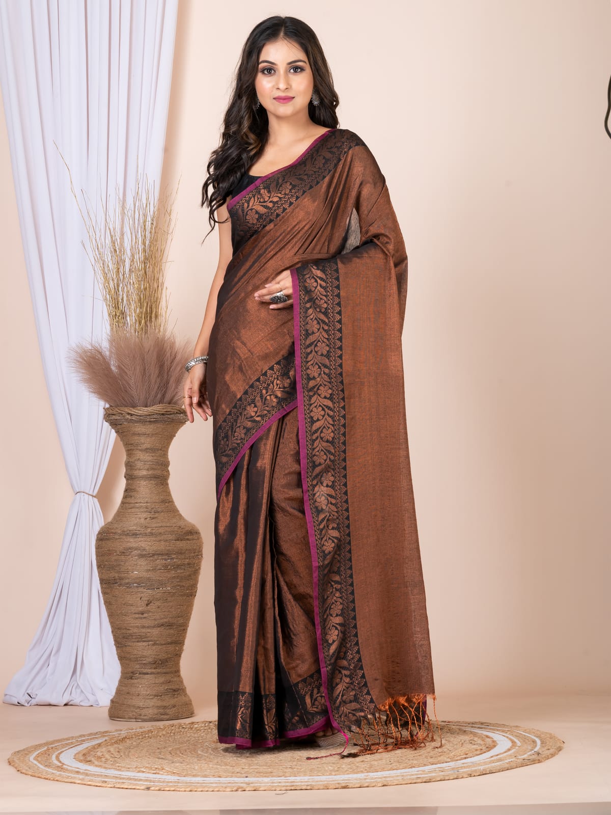 Tissue saree with floral border.