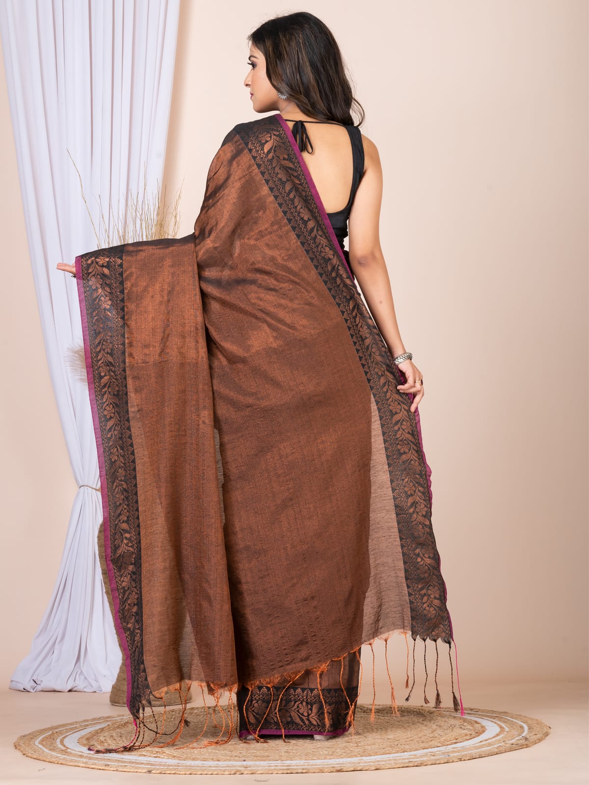 Tissue saree with floral border.